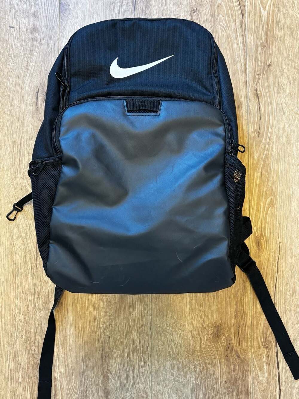 Nike Brasilia Black Backpack with Water-Resistant Front Panel and Laptop Sleeve